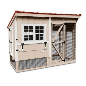 simple chicken coop with neutral beige paint. the front of the coop is show. it has two slider windows that will open and egg collection door in the front side