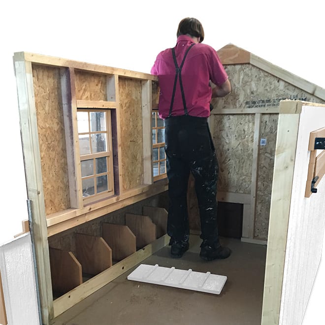 Amish Builder Constructing Chicken Coop Kit